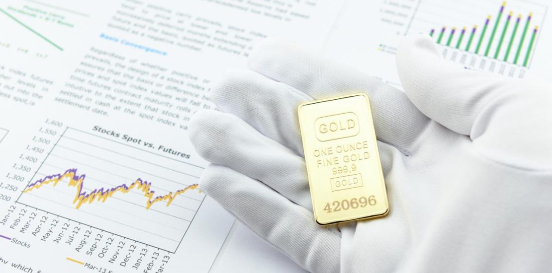 Man with a white handy glove and a gold bar